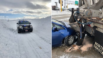 'Sprawling' winter storm slams upper Midwest and Plains, canceling hundreds of flights as it heads East