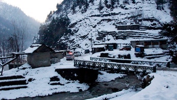 Girl found alive after buried 18 hours under Pakistan avalanche as severe winter weather death toll climbs