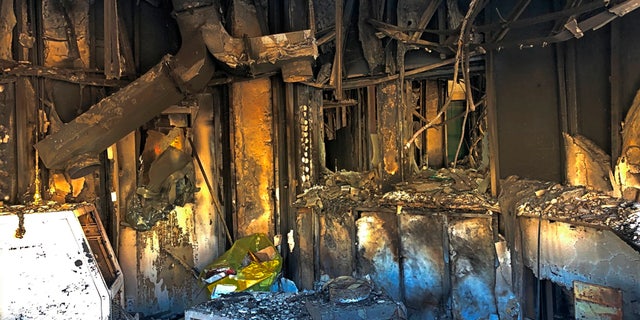 Fire damage can be seen in a reception room of the U.S. embassy compound, that was burned by pro-Iranian militiamen and their supporters, in Baghdad, Iraq, Wednesday, Jan. 1, 2020. On Tuesday, dozens of protesters had broken into the compound, trashing a reception area and smashing windows . (AP Photo/Qassim Abdul-Zahra)