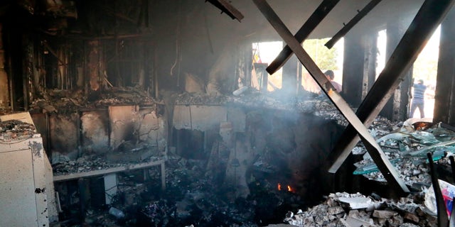 US updates Iraq travel warning following 'Iranian-backed terrorist attacks' on Baghdad embassy 3 Smoke rises from the reception room of the U.S. embassy that was burned by Pro-Iranian militiamen and their supporters, in Baghdad, Iraq, Wednesday, Jan. 1, 2020. (AP Photo/Khalid Mohammed)