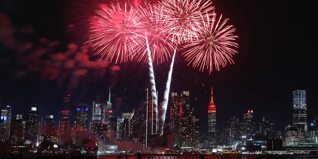 WEEHAWKEN, NJ - JANUARY 23: Fireworks light up the sky over the skyline of midtown Manhattan and the Empire State Building in New York City celebrating the upcoming Chinese New Year on January 23, 2020 as seen from Weehawken, New Jersey. (Photo by Gary Hershorn/Getty Images)