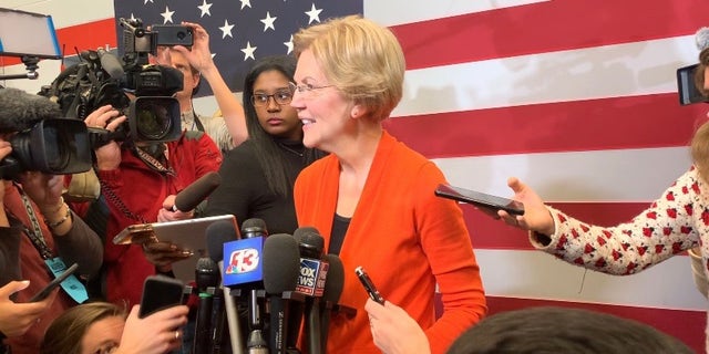 Democratic presidential candidate Sen. Elizabeth Warren speaks with reporters while campaigning in Marshalltown, Iowa on Jan. 12, 2019. Warren comes out with a new book, "Persist" on May 4, 2021.