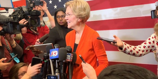 Democratic presidential candidate Sen. Elizabeth Warren speaks with reporters while campaigning in Marshalltown, Iowa on Jan. 12, 2019