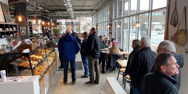 The lunchtime crowd arrives at the Scenic Route Bakery in the East Village neighborhood of Des Moines, Iowa on Jan. 15, 2020