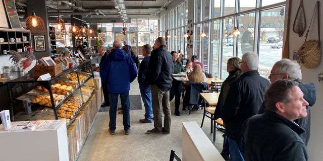 The lunchtime crowd arrives at the Scenic Route Bakery in the East Village neighborhood of Des Moines, Iowa on Jan. 15, 2020