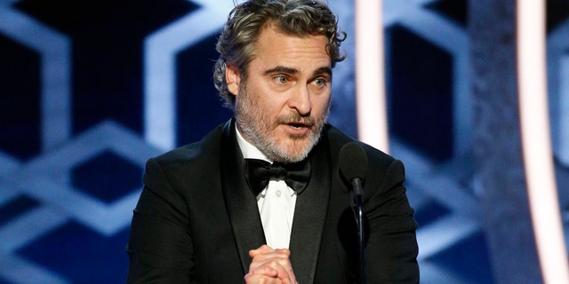 This image released by NBC shows Joaquin Phoenix accepting the award for best actor in a motion picture drama for his role in "Joker" at the 77th Annual Golden Globe Awards at the Beverly Hilton Hotel in Beverly Hills, Calif., on Sunday, Jan. 5, 2020.