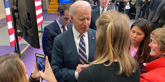 Former Vice President Joe Biden talks to voters after giving a campaign speech in Waukee, Iowa on Jan. 30, 2020