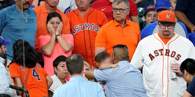 FILE - In this Wednesday, May 29, 2019, file photo, a young child is carried from the stands after being injured by a foul ball off the bat of Chicago Cubs' Albert Almora Jr. during the fourth inning of a baseball game against the Houston Astros, in Houston. (AP Photo/David J. Phillip, File)