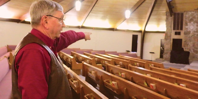 In this Dec. 27, 2019, photo, Bart Bartels, who leads the security team at Northfield Church in Gering, Neb., talks about how members of the church's security team. (Maunette Loeks/The Star-Herald via AP)