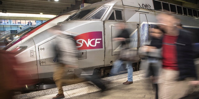 Travelers arrive at Gare Montparnasse train station during the 29th day of transport strikes in Paris, Thursday, Jan. 2, 2020. The start of 2020 was the second New Year celebration in a row where Macron has faced social upheaval.
