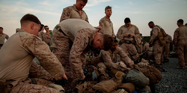 Iran-backed militiamen withdraw from siege of US Embassy in Baghdad as more American troops deployed 4 In this photo provided by U.S. Department of Defense, U.S. Marines assigned to Special Purpose Marine Air-Ground Task Force-Crisis Response-Central Command (SPMAGTF-CR-CC) 19.2, prepare to deploy from Kuwait in support of a crisis response mission, Tuesday, Dec. 31, 2019. The SPMAGTF-CR-CC is designed to move to support operations throughout the Middle East. (U.S. Marine Corps photos by Sgt. Robert G. Gavaldon via AP)