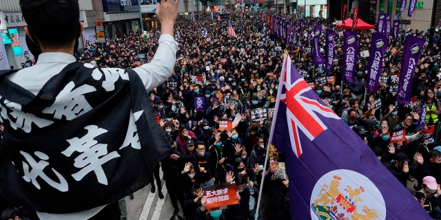 Hong Kong government using coronavirus as 'golden opportunity' to crack down on pro-democracy movement, arrested activist claims 3 A man waves Hong Kong's colonial flag as people participate in their annual pro-democracy march on New Year's Day to insist their five demands be matched by the government in Hong Kong, Wednesday, Jan. 1, 2020. The five demands include democratic elections for Hong Kong's leader and legislature and a demand for a probe of police behavior during the six months of continuous protests. (AP Photo/Vincent Yu)