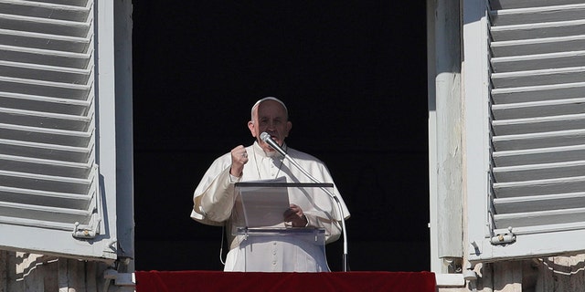 Pope Francis recites the Angelus prayer from his studio's window overlooking St. Peter's square at the Vatican, Wednesday, Jan. 1, 2020. (AP Photo/Gregorio Borgia)