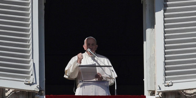 Pope Francis recites the Angelus prayer from his studio's window overlooking St. Peter's square at the Vatican, Wednesday, Jan. 1, 2020. (AP Photo/Gregorio Borgia)