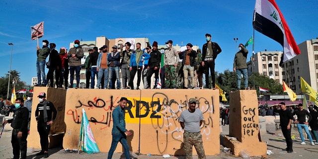 Dozens of pro-Iranian militiamen and their supporters had camped out overnight at the gates of the embassy in Baghdad. (AP Photo/Khalid Mohammed)