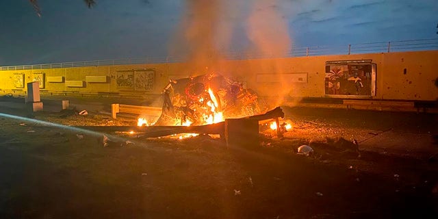 This photo released by the Iraqi Prime Minister Press Office shows a burning vehicle at the Baghdad International Airport following an airstrike in Baghdad, Iraq, early Friday, Jan. 3, 2020. The Pentagon said Thursday that the U.S. military has killed Gen. Qassem Soleimani, the head of Iran's elite Quds Force, at the direction of President Donald Trump.