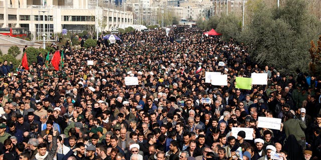 Protesters demonstrate over the U.S. airstrike in Iraq that killed Iranian Revolutionary Guard Gen. Qassem Soleimani in Tehran, Iran, Friday Jan. 3, 2020. Iran has vowed "harsh retaliation" for the U.S. airstrike near Baghdad's airport that killed Tehran's top general and the architect of its interventions across the Middle East, as tensions soared in the wake of the targeted killing.