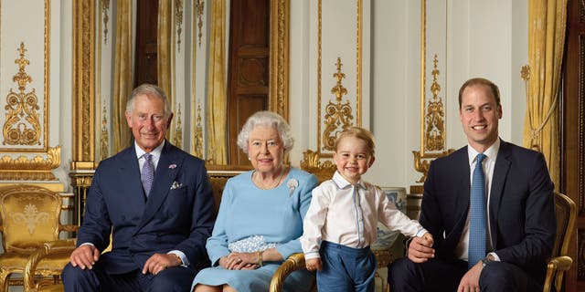 In this file handout photo provided by Buckingham Palace and released in 2016, Queen Elizabeth, Prince Charles, Prince William and Prince George pose for a photo to mark the Queen's 90th birthday, in the White Drawing Room at Buckingham Palace, London. 