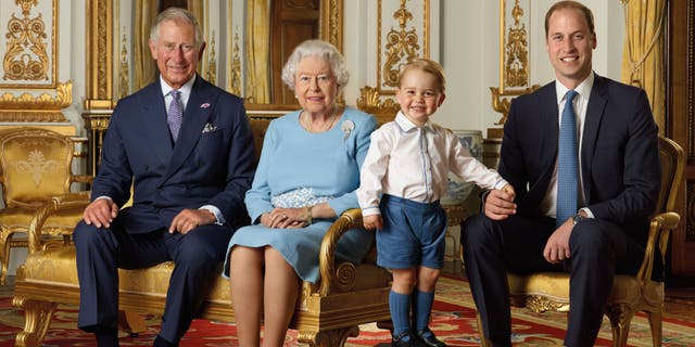 In this file handout photo provided by Buckingham Palace and released in 2016, Queen Elizabeth, Prince Charles, Prince William and Prince George pose for a photo to mark the Queen's 90th birthday, in the White Drawing Room at Buckingham Palace, London. 