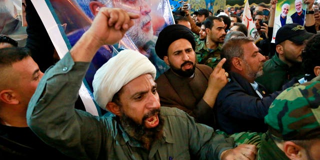 Mourners chant slogans against the U.S. during the funeral of Iran's top general Qassem Soleimani, and Abu Mahdi al-Muhandis, deputy commander of Iran-backed militias in Iraq known as the Popular Mobilization Forces, in the shrine of Imam Hussein in Karbala, Iraq, Saturday, Jan. 4, 2020.