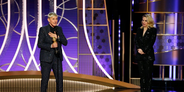 This image released by NBC shows Ellen DeGeneres accepts the Carol Burnett TV Achievement Award as presenter Kate McKinnon, right, looks on at the 77th Annual Golden Globe Awards.