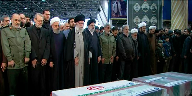 Ayatollah Ali Khamenei, fourth from left, leads a prayer over the coffins of Gen. Qassem Soleimani and others who were killed in Iraq in a U.S. drone strike on Friday. (Office of the Iranian Supreme Leader via AP)