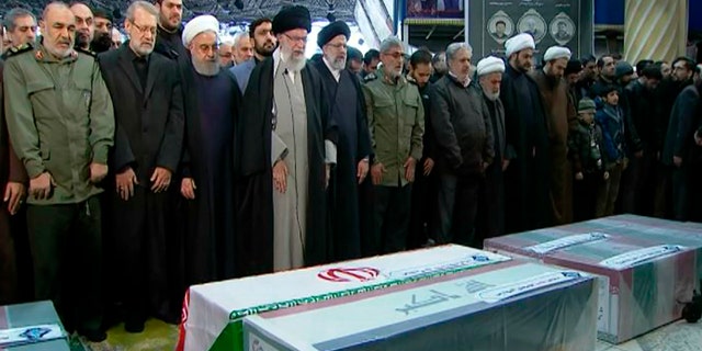 Ayatollah Ali Khamenei, fourth from left, leads a prayer over the coffins of Gen. Qassem Soleimani and others who were killed in Iraq in a U.S. drone strike on Friday. (Office of the Iranian Supreme Leader via AP)