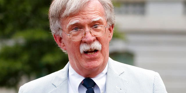 FILE - In this July 31, 2019 file photo, then National security adviser John Bolton speaks to media at the White House in Washington.  Bolton says he's 'prepared to testify' in Senate impeachment trial if subpoenaed (AP Photo/Carolyn Kaster)