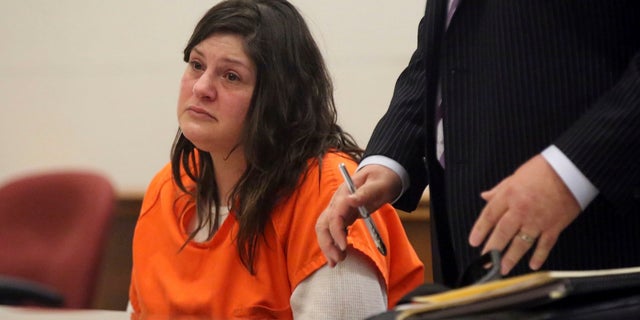 Heather Barbera, with her attorney James Leonard, speaks to Atlantic County Superior Court Judge Bernard DeLury on Thursday before she was sentenced for the slaying of her mother and grandmother in their Ventnor condo. (Vernon Ogrodnek/The Philadelphia Inquirer via AP, Pool)