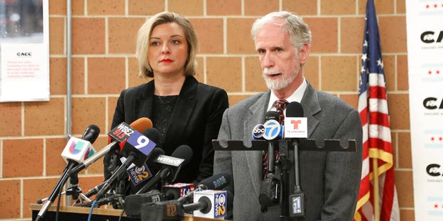 Dr. Tom Wake, the interim administrator of Cook County Animal and Rabies Control, speaks with reporters in Chicago, Thursday, Jan. 9, 2020, while Kelley Gandurski, executive director of the Chicago Animal Care and Control, stands next to him.