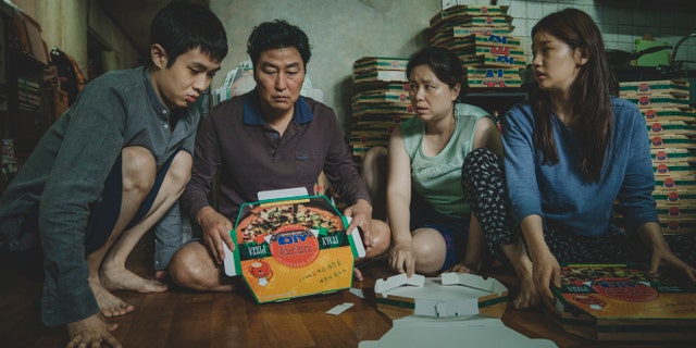 This image released by Neon shows Woo-sik Choi, from left, Kang-ho Song, Hye-jin Jang and So-dam Park in a scene from 