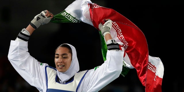 In this Aug. 18, 2016 file photo, Kimia Alizadeh Zenoorin of Iran celebrates after winning the bronze medal in a women's Taekwondo competition at the 2016 Summer Olympics in Rio de Janeiro, Brazil. (AP Photo/Andrew Medichini, File)