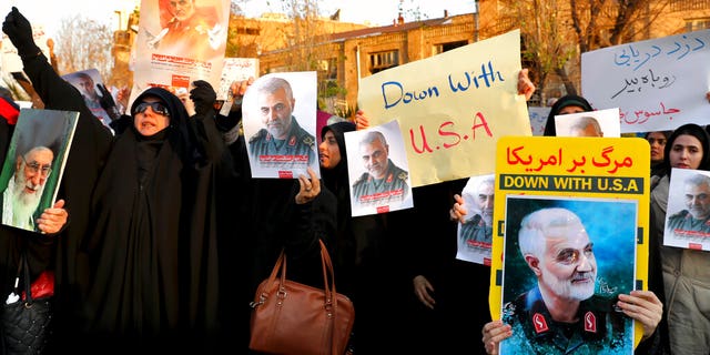 Protesters chanting slogans and holding up posters of Gen. Qassem Soleimani during a demonstration in front of the British Embassy in Tehran on Sunday.