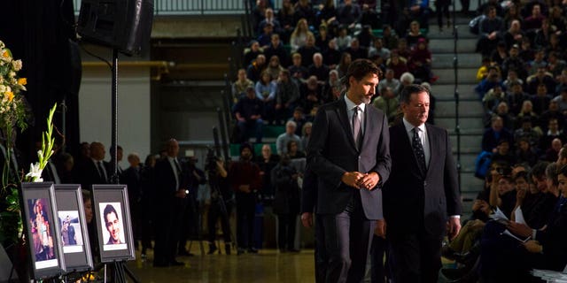 Canadian Prime Minister Justin Trudeau, left, with Alberta Premier Jason Kenney on Sunday during a memorial in Edmonton for the victims of the Ukrainian plane disaster in Iran this past week.