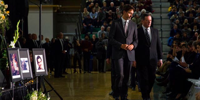 Canadian Prime Minister Justin Trudeau, left, with Alberta Premier Jason Kenney on Sunday during a memorial in Edmonton for the victims of the Ukrainian plane disaster in Iran this past week.