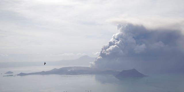 Taal Volcano continues to spew ash on Monday Jan. 13, 2020, in Tagaytay, Cavite province, south of Manila, Philippines. (AP Photo/Aaron Favila)