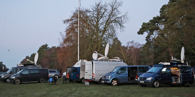 Media prepares in the early morning at the entrance of the castle in Sandringham, England, Monday, Jan. 13, 2020.