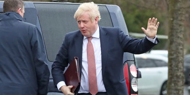 Britain's Prime Minister Boris Johnson visits Stormont, Belfast, Northern Ireland, Monday Jan. 13, 2020, as the power-sharing Northern Ireland assembly starts up.