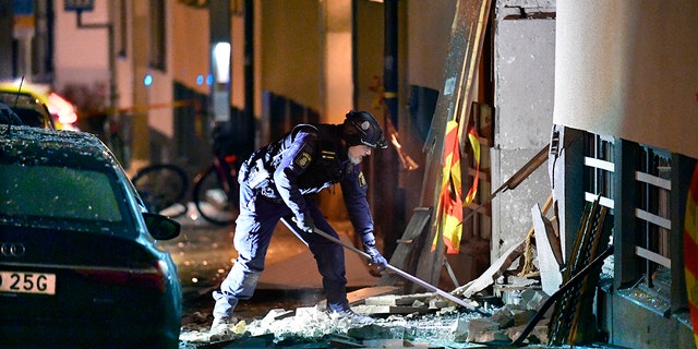 Police work at the scene of an explosion that caused damage to a residential building in central Stockholm, early Monday, Jan. 13, 2020. There were no reported injuries. (Anders Wiklund/TT News Agency via AP)