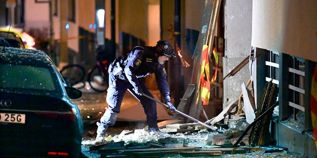 Police work at the scene of an explosion that caused damage to a residential building in central Stockholm, early Monday, Jan. 13, 2020. There were no reported injuries. (Anders Wiklund/TT News Agency via AP)