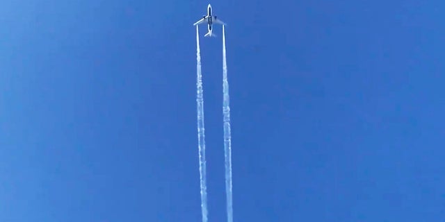 In this photo from video, Delta Air Lines Flight 89 to Shanghai, China dumps fuel over Los Angeles before returning to Los Angeles International Airport for an emergency landing Tuesday. Fire officials say fuel apparently dumped by the aircraft returning to LAX fell onto an elementary school playground. (AP Photo/Matt Hartman)