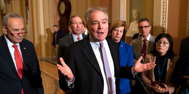 Sen. Tim Kaine, D-Va., center, joined from left by Senate Minority Leader Chuck Schumer, D-N.Y., Sen. Tom Udall, D-N.M., and Sen. Tammy Baldwin, D-Wis., meets with reporters as the House prepares to send the articles of impeachment against President Trump to the Senate, at the Capitol in Washington, Tuesday, Jan. 14, 2020. Kaine also discussed his War Powers Resolution that the Senate is expected to vote on soon. (AP Photo/J. Scott Applewhite)
