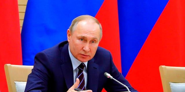 Russian President Vladimir Putin speaks as he chairs a meeting on drafting constitutional changes at the Novo-Ogaryovo residence outside Moscow, Russia.