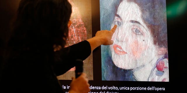 Art experts have confirmed that a stolen painting discovered hidden inside an Italian art gallery's walls is indeed the same stolen in 1997.