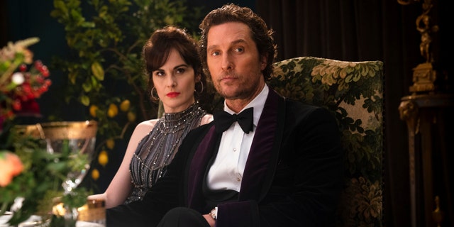 Michelle Dockery, left, and Matthew McConaughey in a scene from "The Gentlemen."