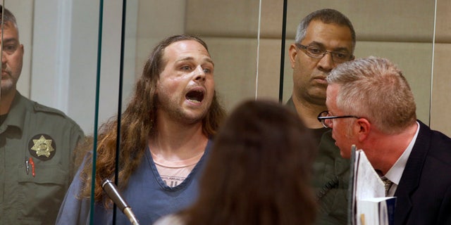 In this May 30, 2017, file photo, Jeremy Christian shouts as he is arraigned in Multnomah County Circuit Court in Portland, Ore. (Beth Nakamura/The Oregonian via AP, Pool, File)