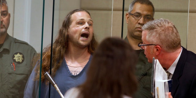 In this 2017 photo, Jeremy Christian shouts as he is arraigned in Multnomah County Circuit Court in Portland, Ore. (Beth Nakamura/The Oregonian via AP, Pool, File)