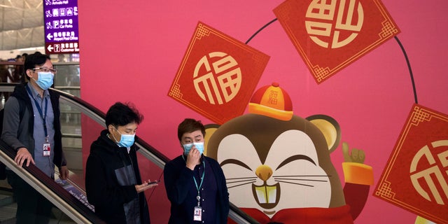 Face masks sold out and temperature checks at airports and train stations became the new norm as China strove Tuesday to control the outbreak of a new coronavirus that has reached four other countries and territories and threatens to spread further during the Lunar New Year travel rush.