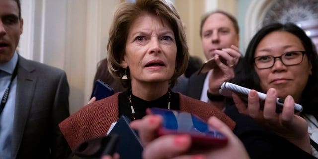 Sen. Lisa Murkowski, R-Alaska, arrives at the Senate for the start of the impeachment trial of President Donald Trump on charges of abuse of power and obstruction of Congress, at the Capitol in Washington, Tuesday, Jan. 21, 2020. (AP Photo/J. Scott Applewhite)