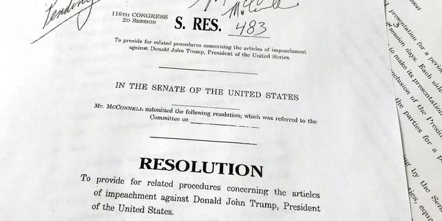 A copy of revised U.S. Senate Resolution 483, which provides procedures concerning the articles of impeachment against President Donald Trump, released Tuesday, Jan. 21, 2020 on Capitol Hill in Washington. Senate Majority Leader Mitch McConnell has abruptly changed his proposed rules for President Donald Trump’s impeachment trial after some of his fellow Republican senators objected. (AP Photo/Wayne Partlow)